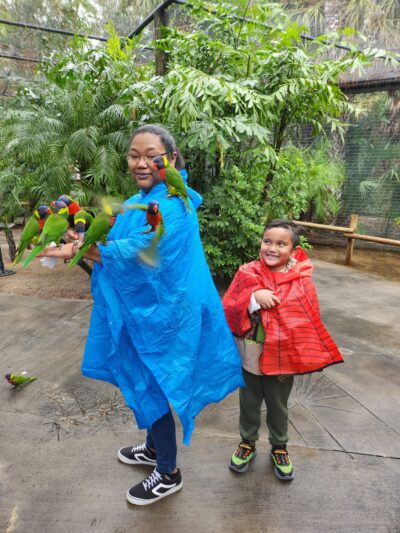 Woman with parrots and little boy