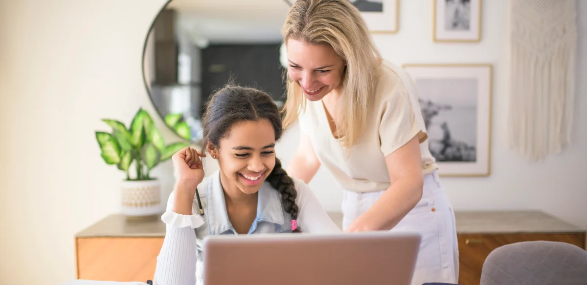 Mother an daughter woring with their laptop