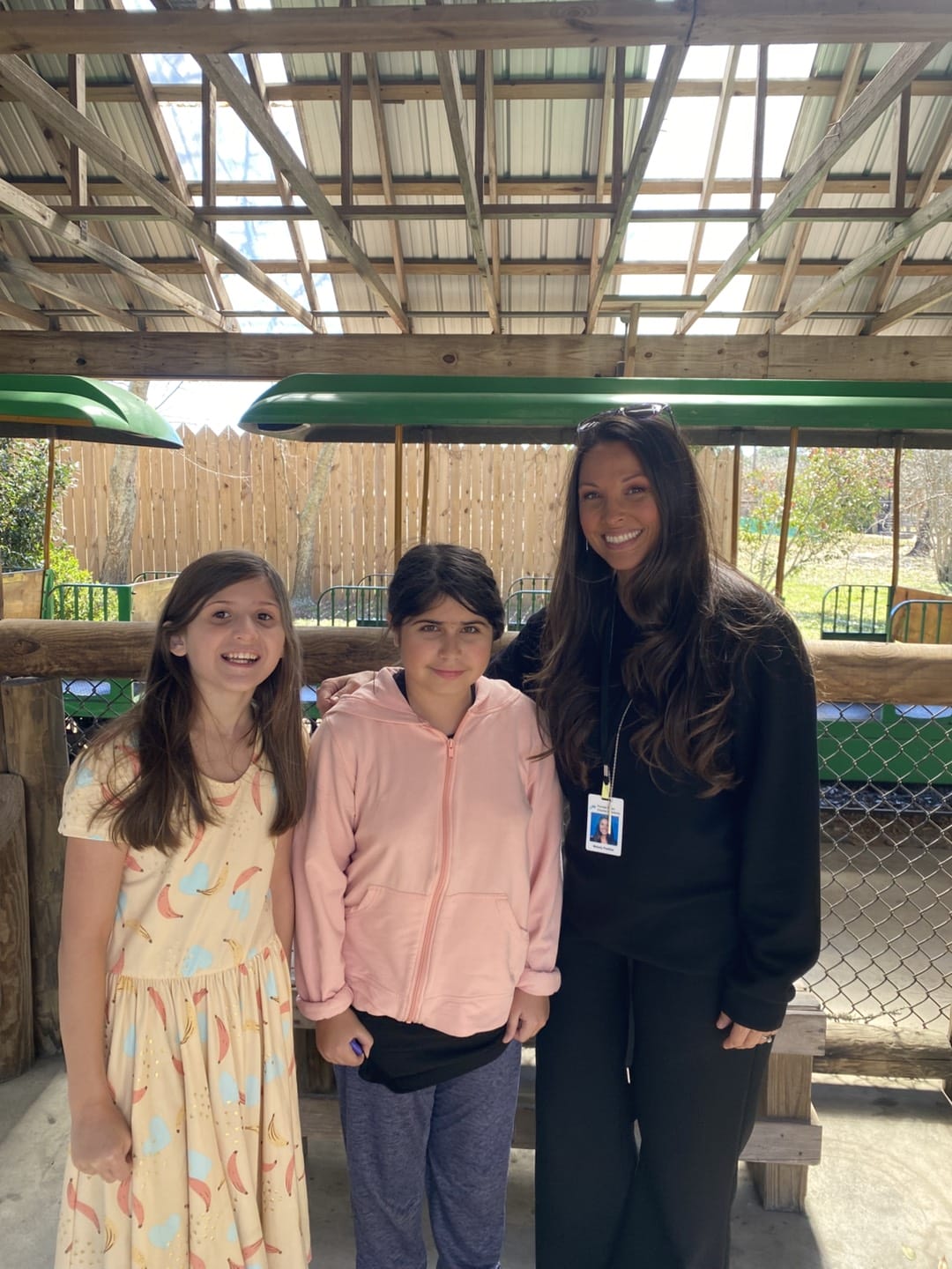 teacher and girls in the zoo